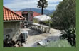 Outdoor kitchen, barbecue and table, near the pool